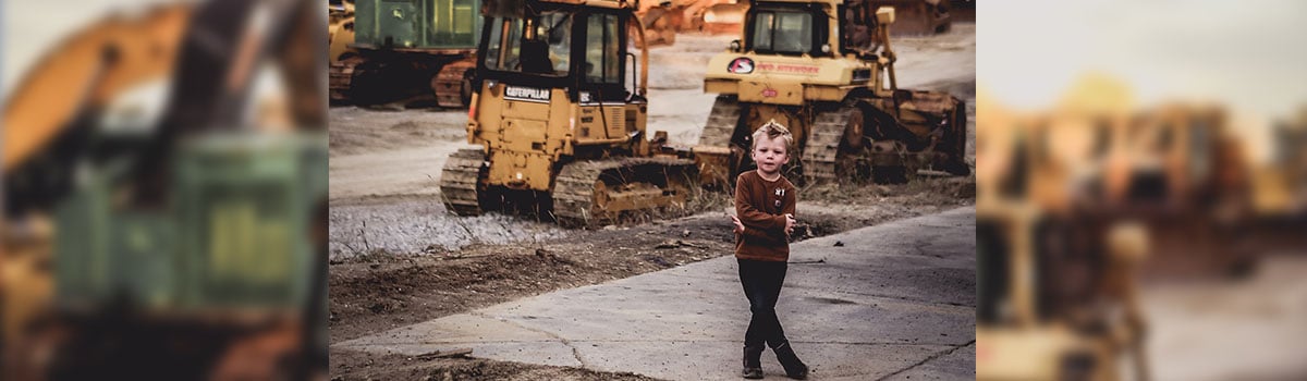 jake standing in front of a dozer